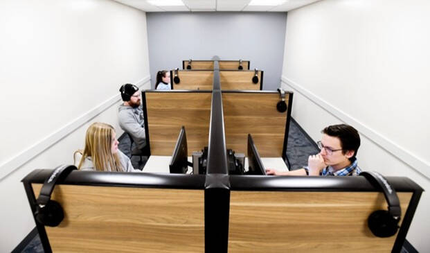 Students sitting at computer desks in ASH 1216 testing room